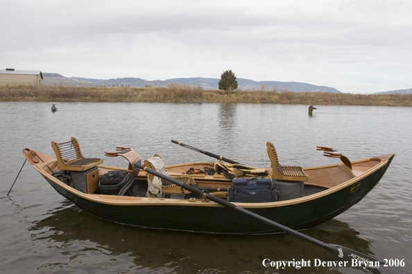 Drift boat on river.