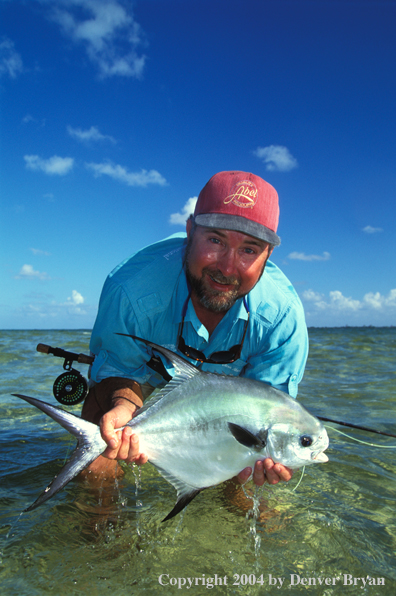 Saltwater flyfisherman holding permit.