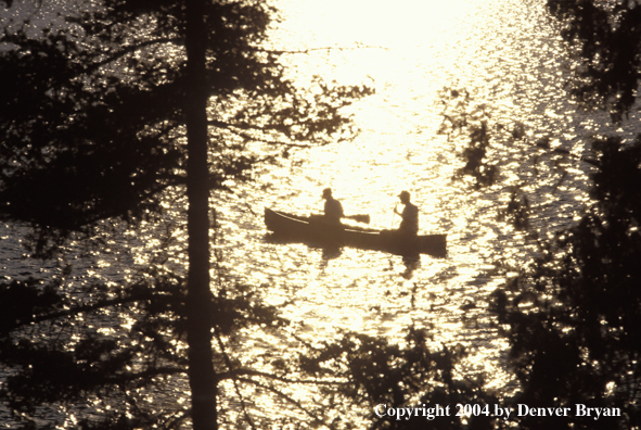 Flyfishermen fishing from cedar canoe.