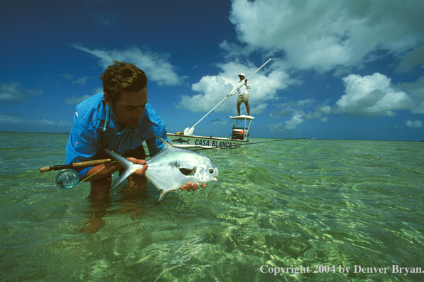 Saltwater flyfisherman holding permit.