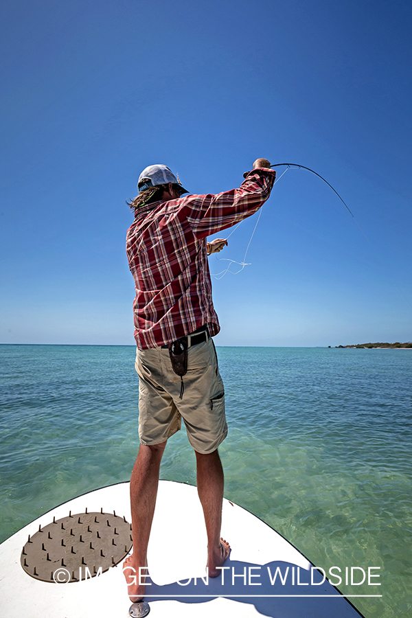 Flyfisherman fighting with bonefish.