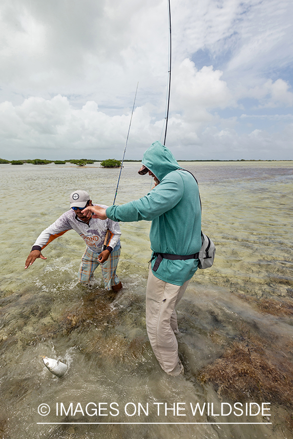 Flyfisherman and guide with Bonefish on the line.