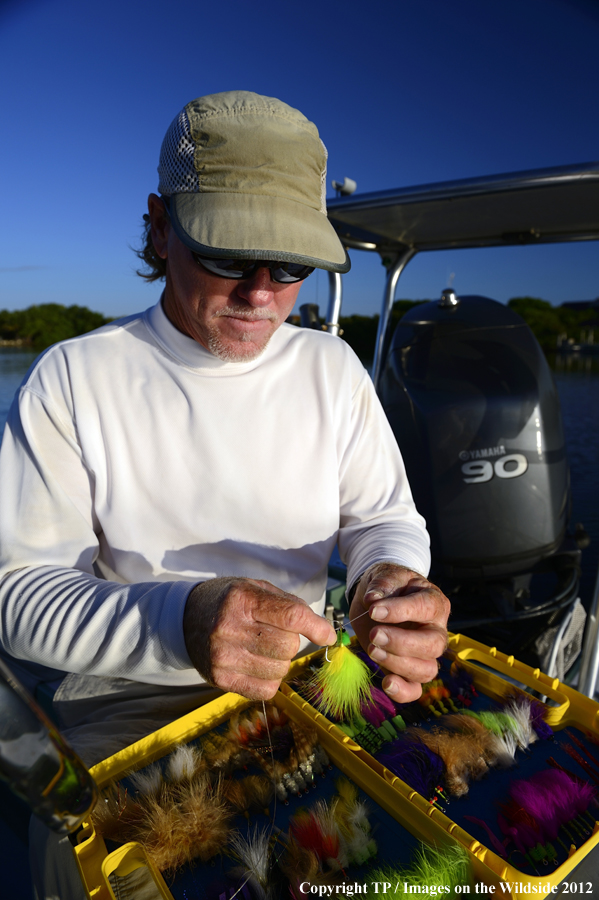 Flyfisherman with fly box. 