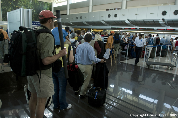 Flyfishermen waiting to check in at airport