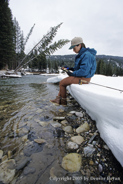 Female flyfisher selecting flies.