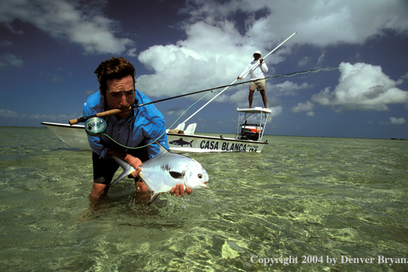 Saltwater flyfisherman holding permit.