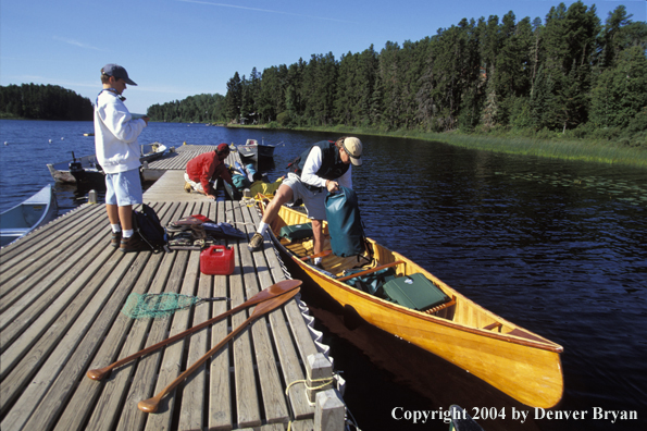 Father and son preparing for a day of fishing.