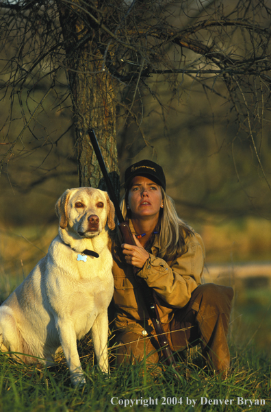 Upland game bird hunter with yellow Lab.