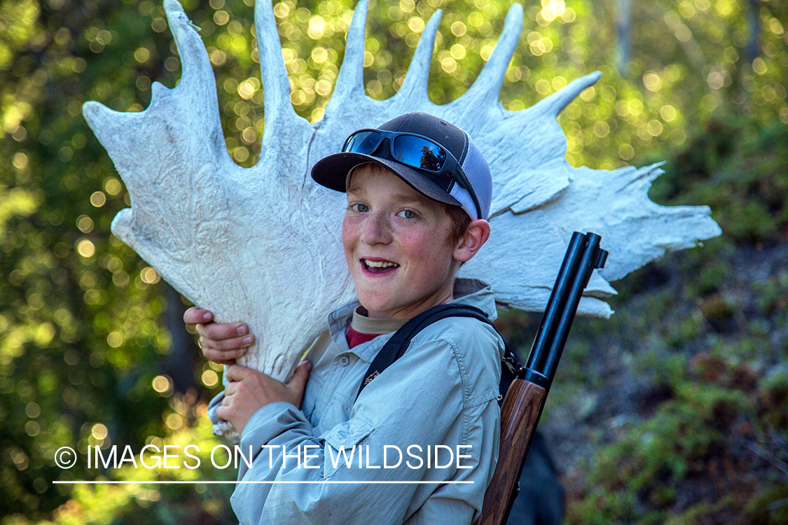 Boy with moose shed antler.