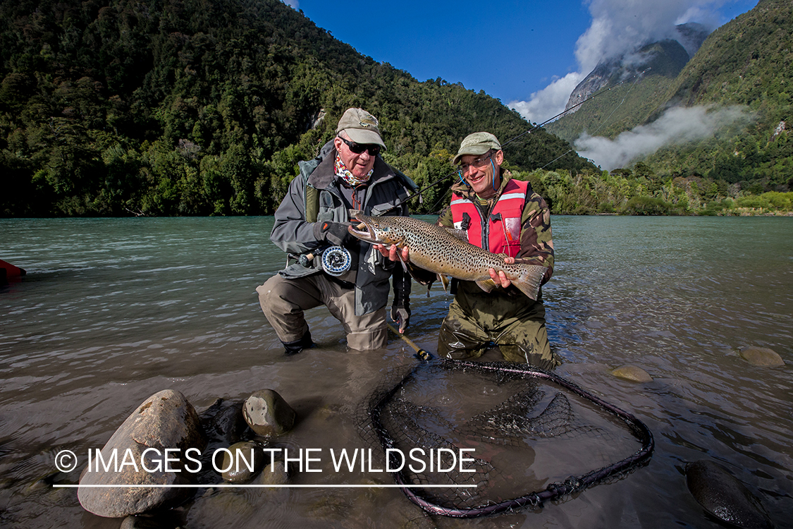 Flyfishermen with brown trout.