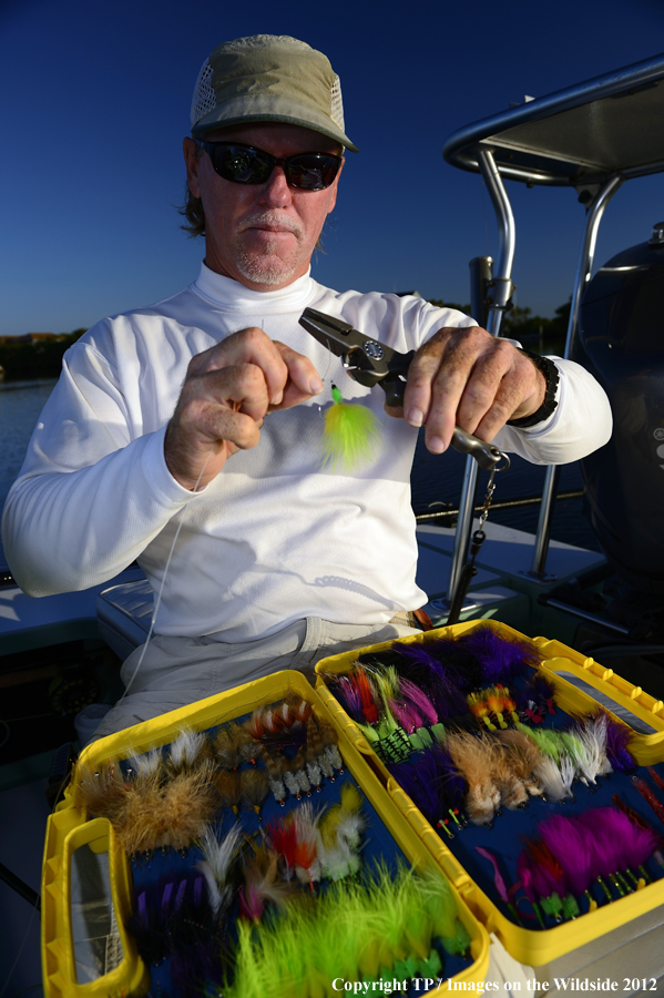 Fisherman with fly box. 