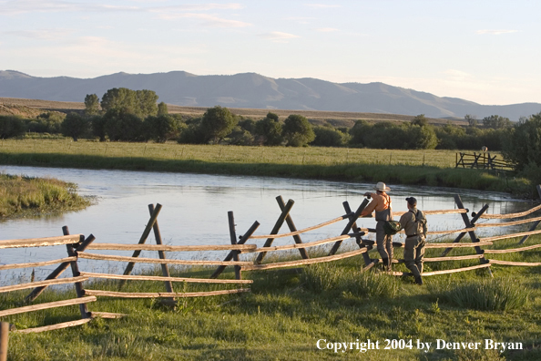 Flyfisherman scouting river.