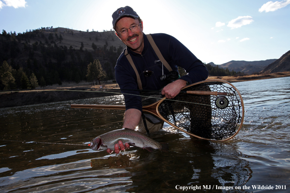 Flyfisherman with a nice rainbow trout.