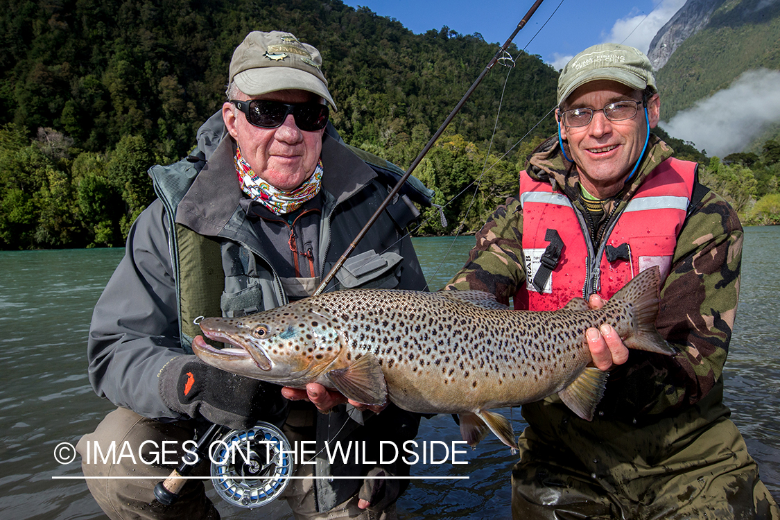 Flyfishermen with brown trout.