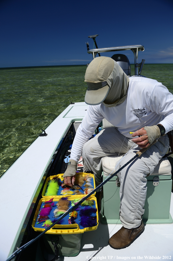 Fisherman with fly box. 