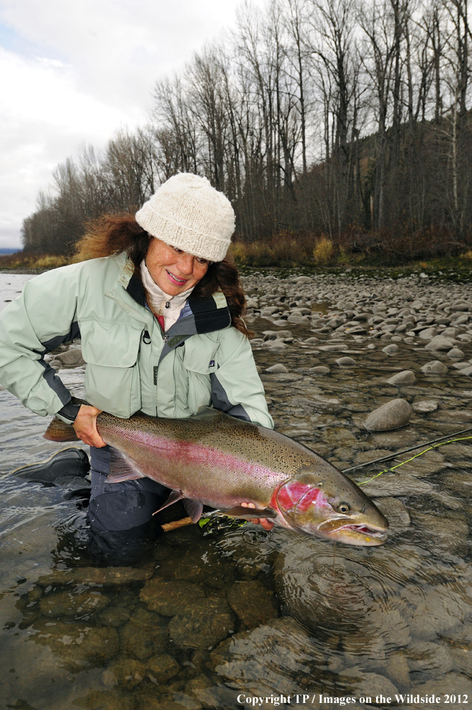 Fisherwoman with Steelhead Trout. 