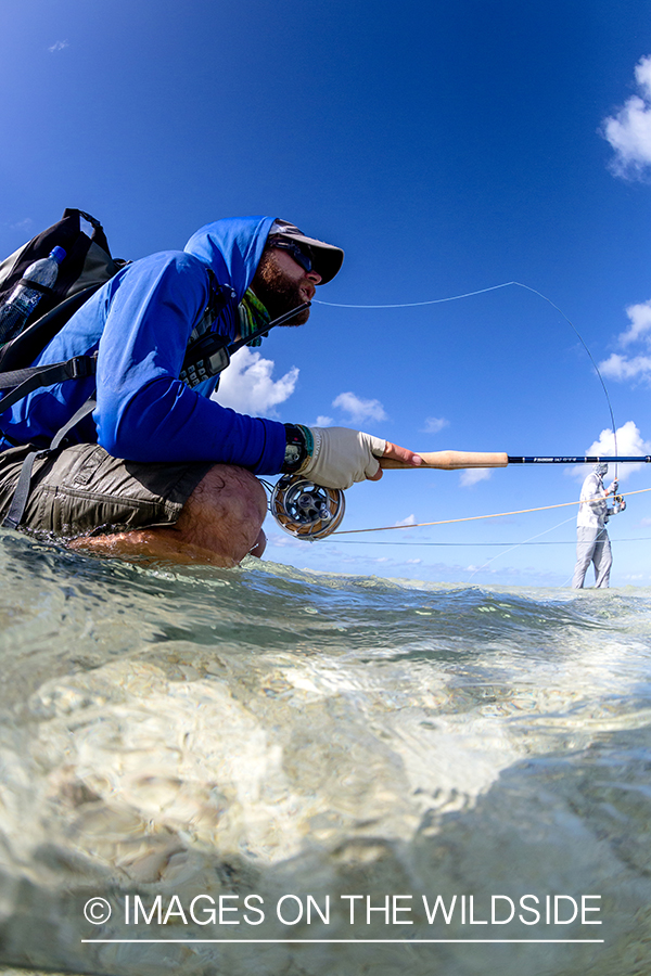 Flyfisherman on St. Brandon's Atoll flats, Indian Ocean.