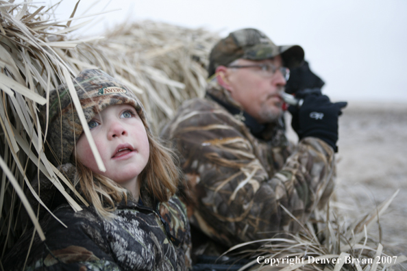 Father and daughter hunting waterfowl