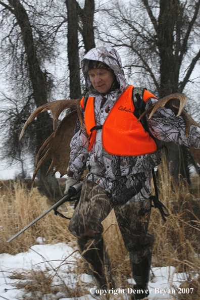 Moose hunter in field