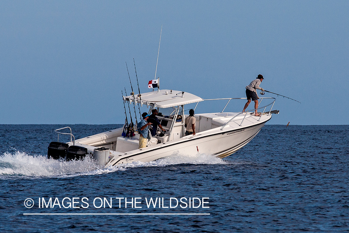 Fishermen on deep sea fishing boat.