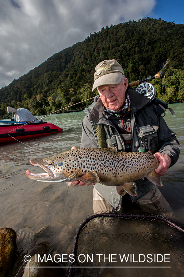 Flyfisherman with brown trout.