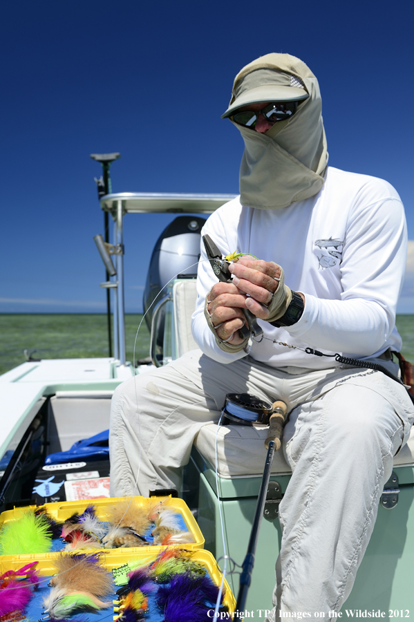 Fisherman with fly box. 