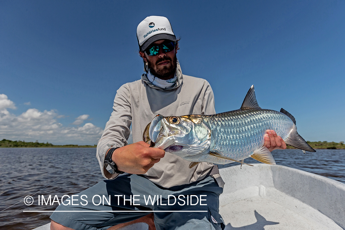 Flyfisherman with baby tarpon.