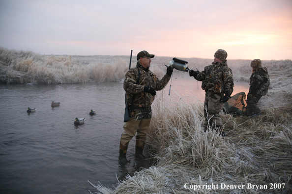 Father and children waterfowl hunting