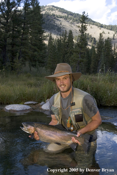 Flyfisherman with Rainbow Trout, Rocky Mountains