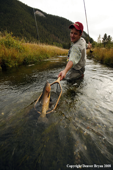 Flyfisherman Landing Cutthroat Trout