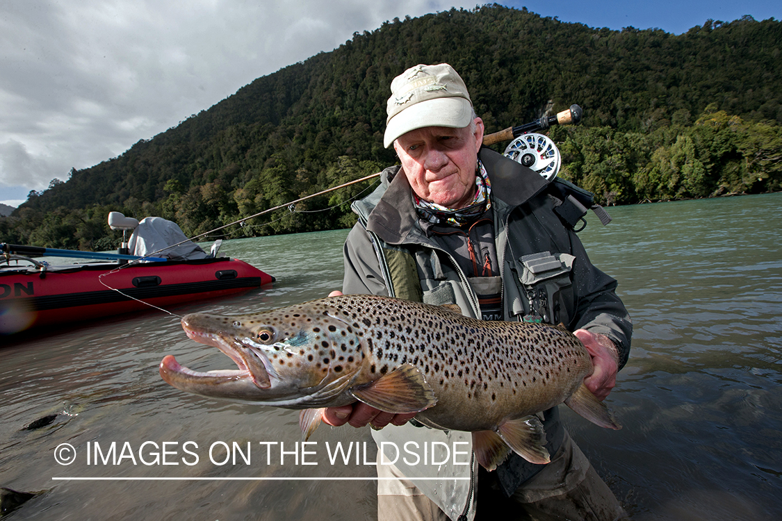 Flyfisherman with brown trout.