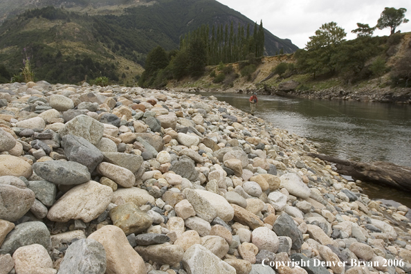 Flyfisherman casting on river.