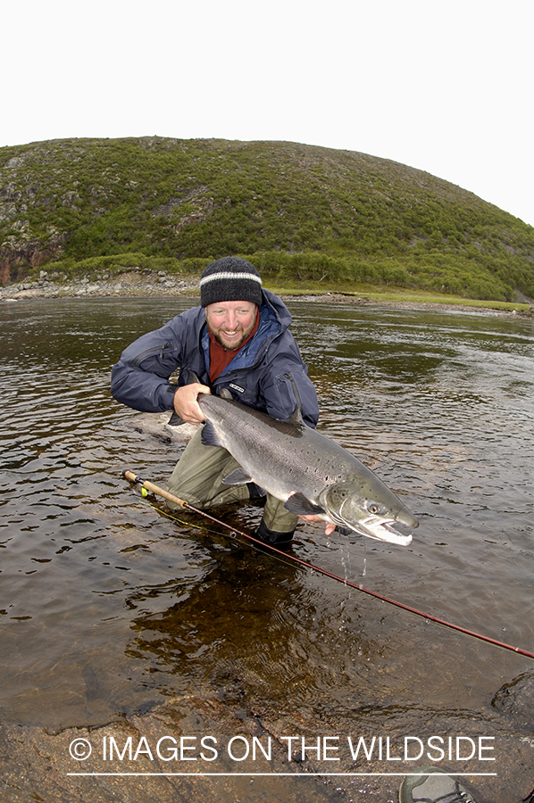 Flyfisherman with salmon.