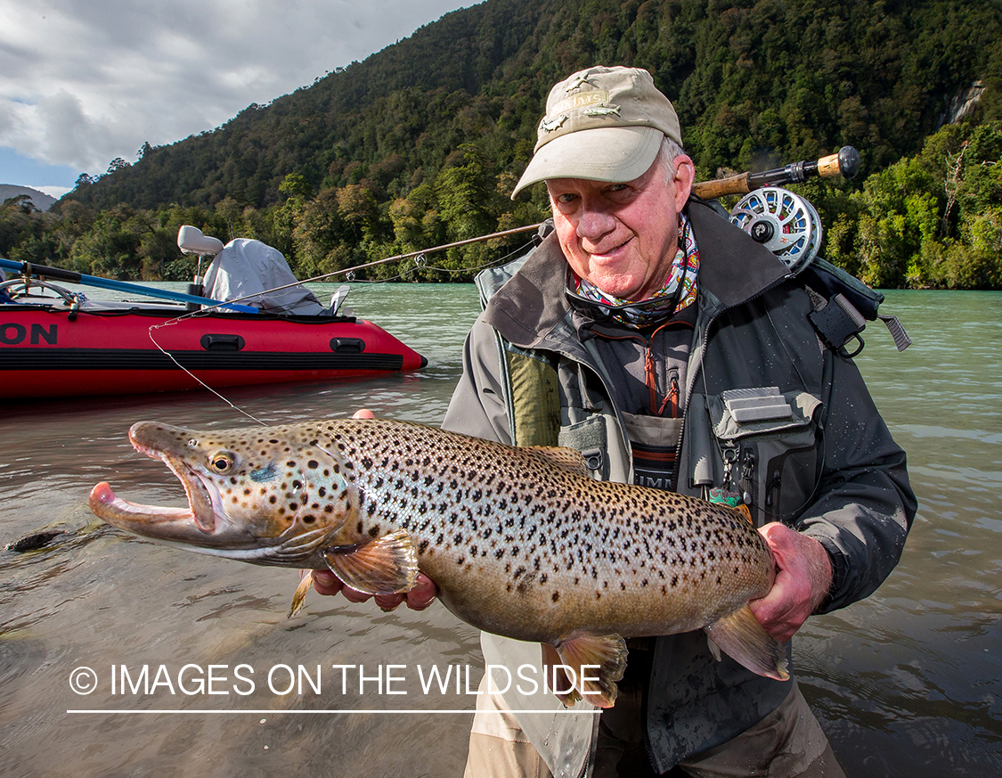 Flyfisherman with brown trout.