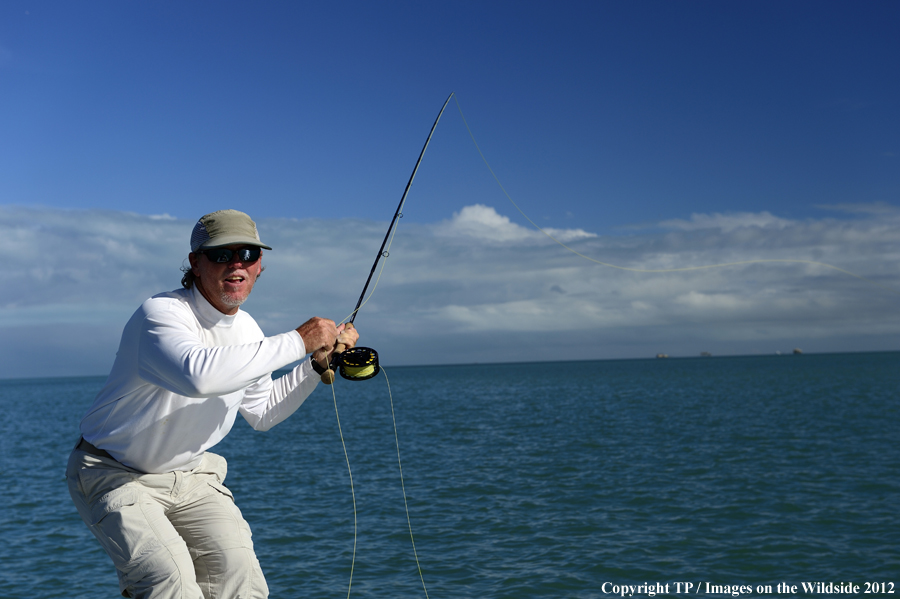 Flyfisherman casting. 