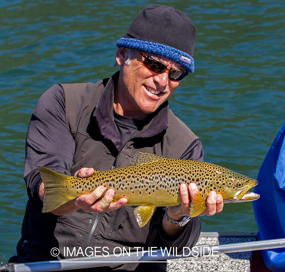 Flyfisherman with brown trout.