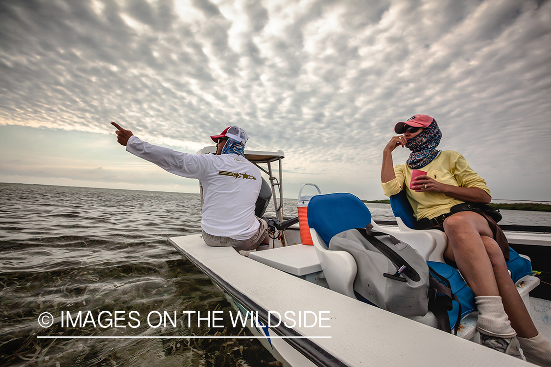 Flyfishermen on flats boat.