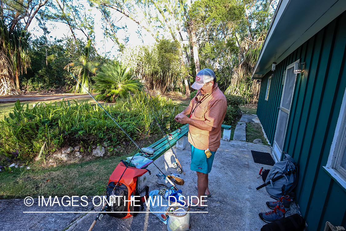 Flyfisherman preparing gear.