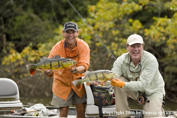 Fishermen holding Peacock Bass