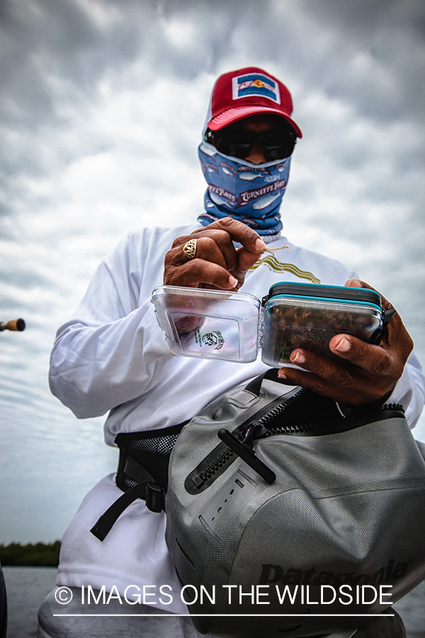 Flyfisherman choosing fly.