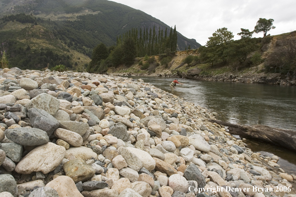 Flyfisherman casting on river.