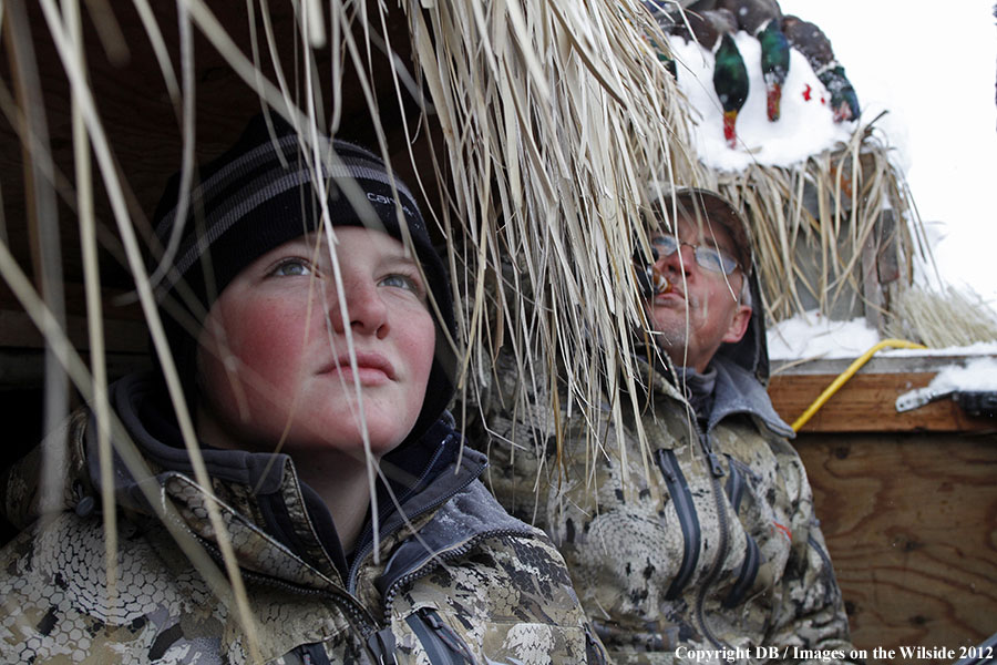 Father and son hunting waterfowl.