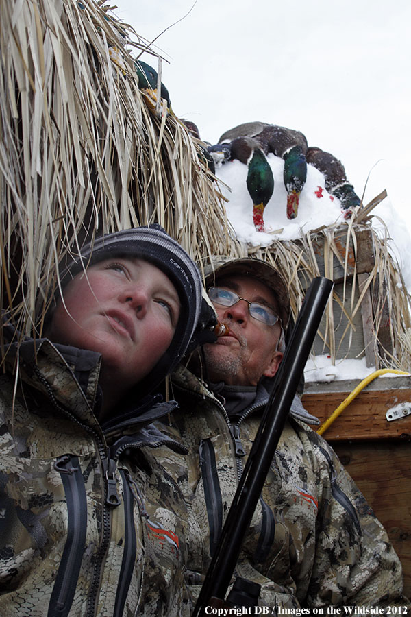 Father and son hunting waterfowl.