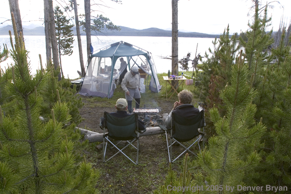 Flyfishermen at lakeside fishing camp.