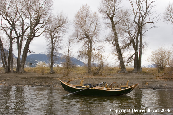 Drift boat on river.