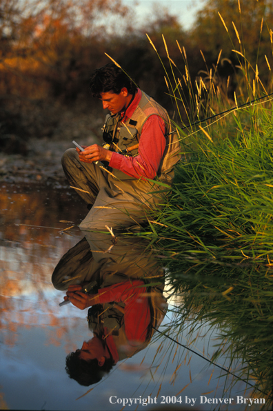 Flyfisherman choosing flies.