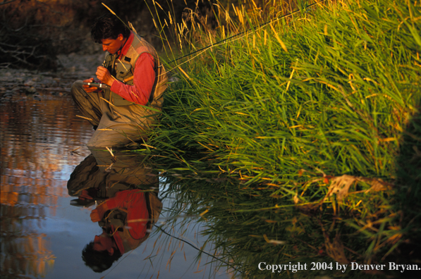 Flyfisherman choosing flies .