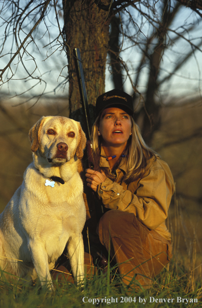 Upland game bird hunter with yellow Lab.