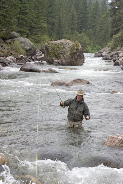 Flyfisherman pocket fishing on stream.