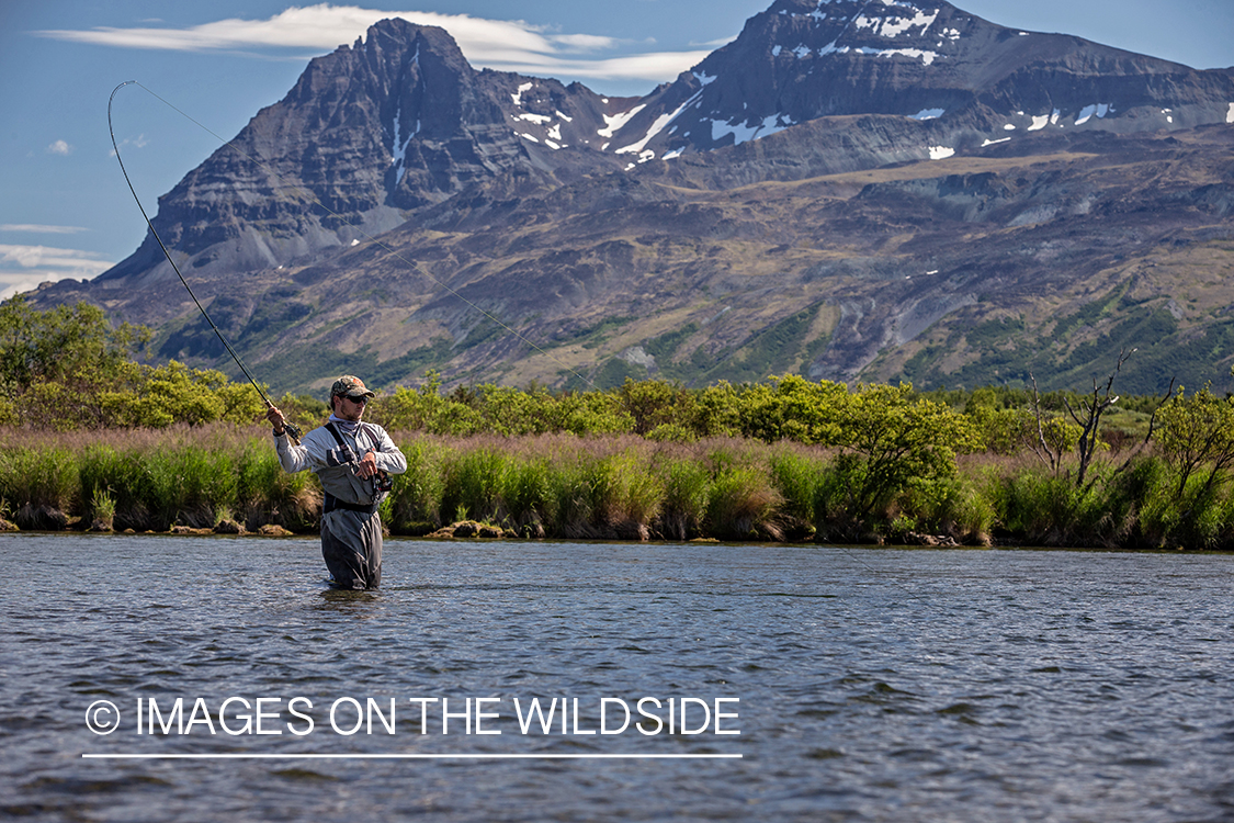 Flyfisherman in water, Alaska.